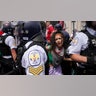 Police detain a pro-Palestinian demonstrator