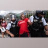 A demonstrator is taken into custody as they protest the visit of Israeli Prime Minister Benjamin Netanyahu on Capitol Hill, Wednesday, July 24, 2024, in Washington. AP Photo/Jose Luis Magana