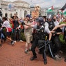 U.S. Park Police officers react while removing a handcuffed demonstrator at a pro-Palestinian protest