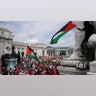 Pro-Palestinian demonstrators wave Palestinian flags outside Union Station