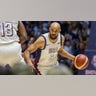 Derrick White dribbles