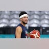 Devin Booker looks on