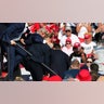 Donald Trump is seen with blood on his face