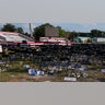 A campaign rally site for Republican presidential candidate former President Donald Trump is empty and littered with debris