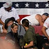 Attendees scatter after gunfire rang out during a campaign rally for Republican presidential candidate, former U.S. President Donald Trump