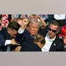 Trump holds fist
