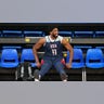 Joel Embiid looks on