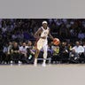 Jrue Holiday dribbles