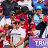 Republican presidential candidate and former U.S. President Donald Trump reacts as multiple shots rang out during a campaign rally