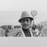 Abdul Duke Fakir wears a hat and sweater.