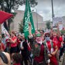 Protester holding Hamas flag