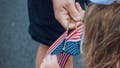 Man handing out American flags - Fox News