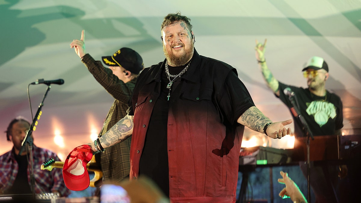 Jelly Roll wears red ombre vest at concert in Hamptons