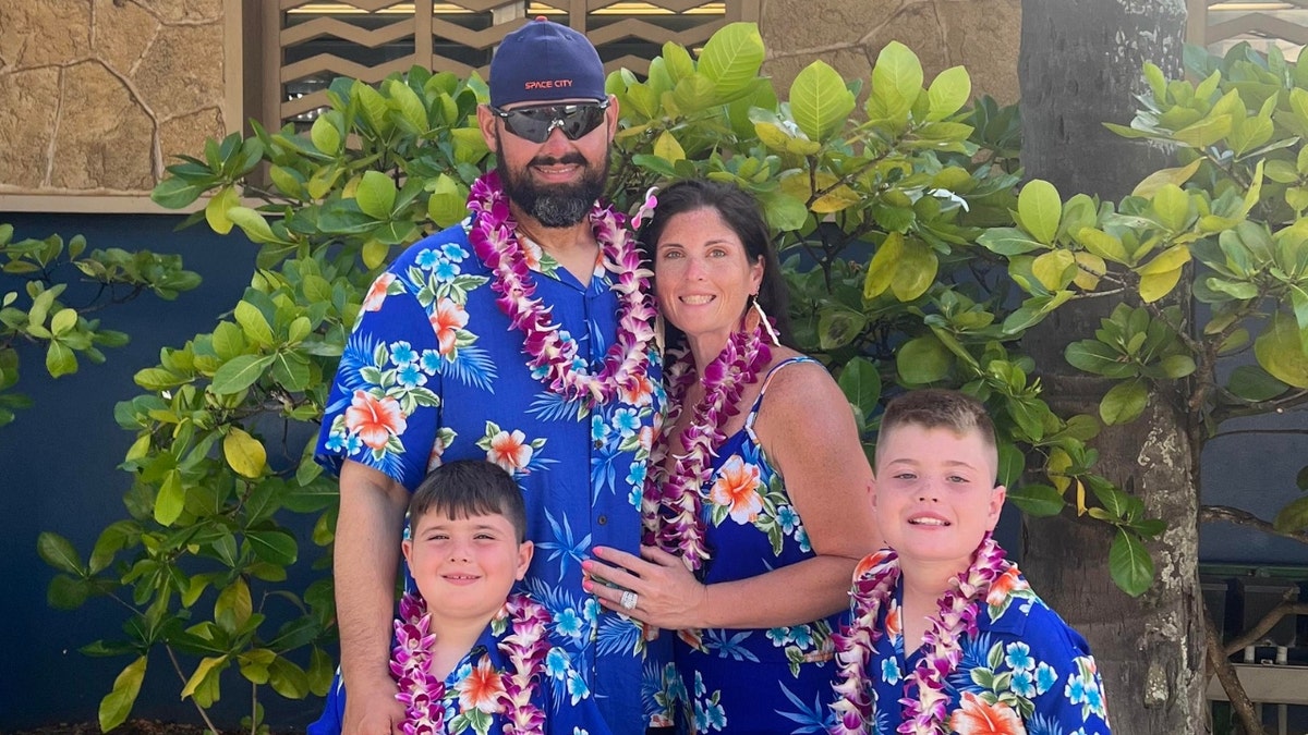 The Maynard family wearing Hawaiian shirts.