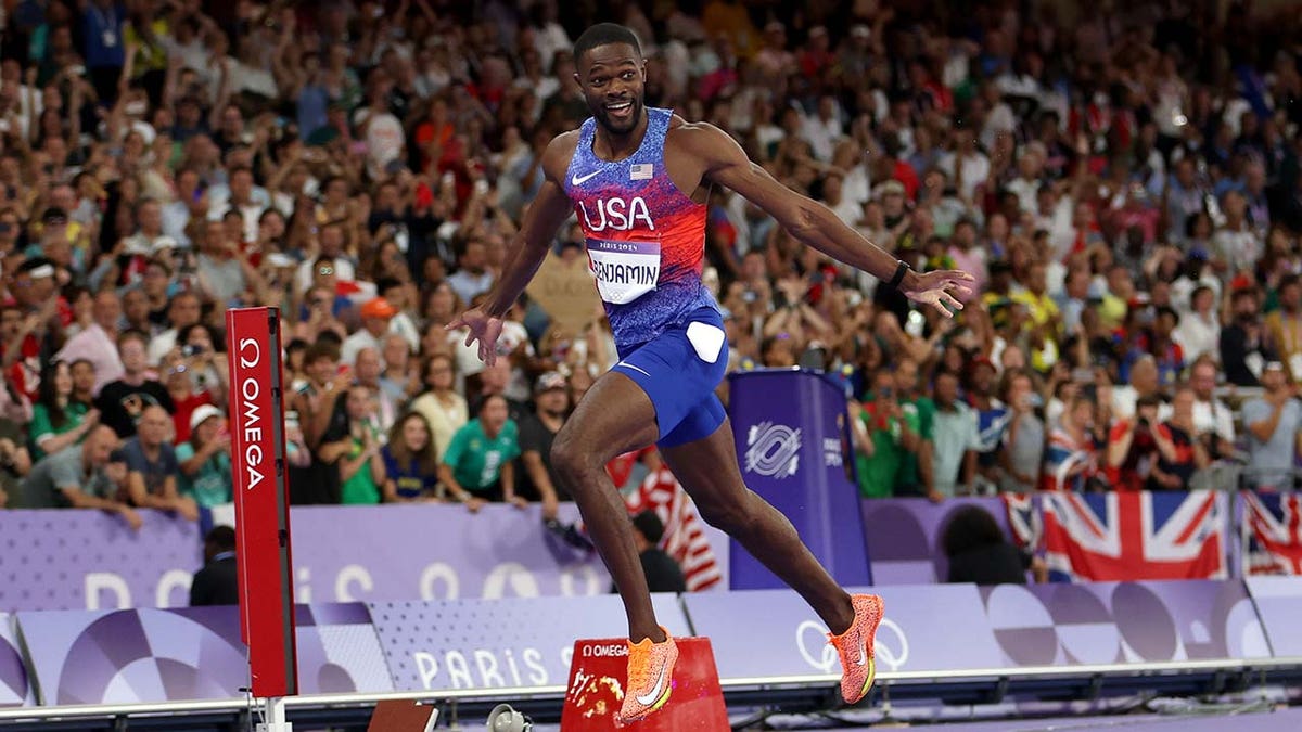 Rai Benjamin competes in the 400-meter hurdles