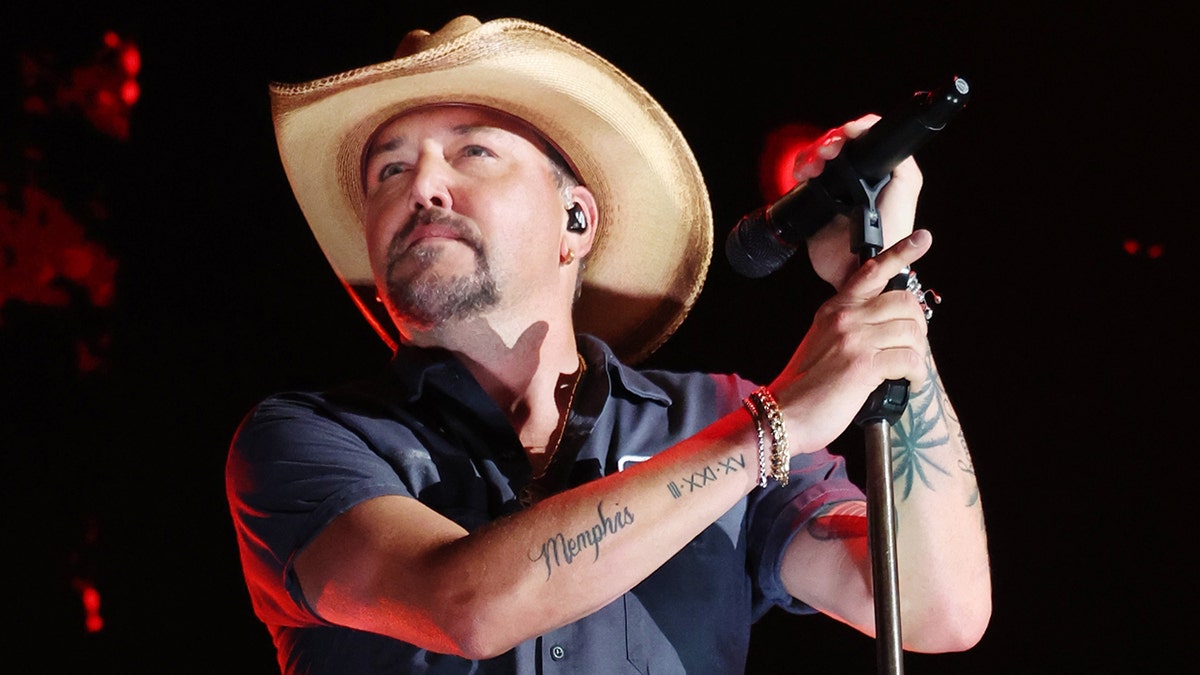 Jason Aldean performing at the iHeartRadio music festival.