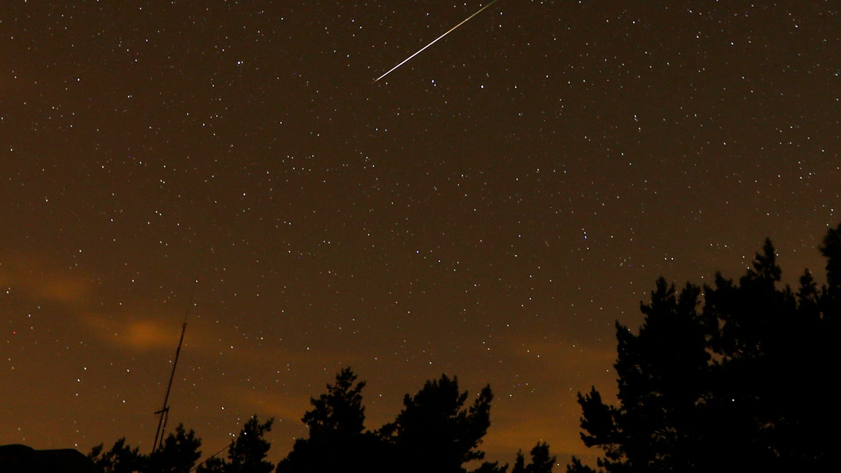 A streak appears in the sky during the annual Perseid meteor shower at the Guadarrama mountains, near Madrid, in the early hours of Aug. 12, 2016.