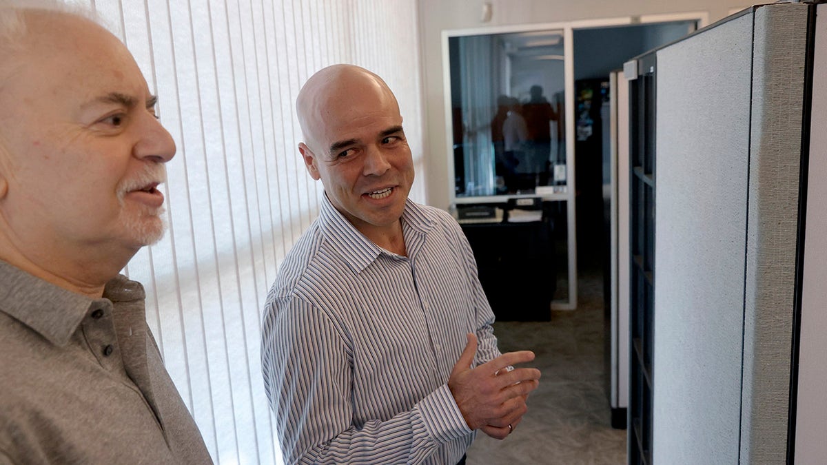 Robert Telles speaks to journalist Jeff German in an office