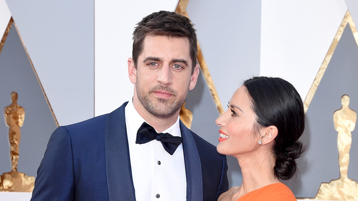 Aaron Rodgers and Olivia Munn on red carpet