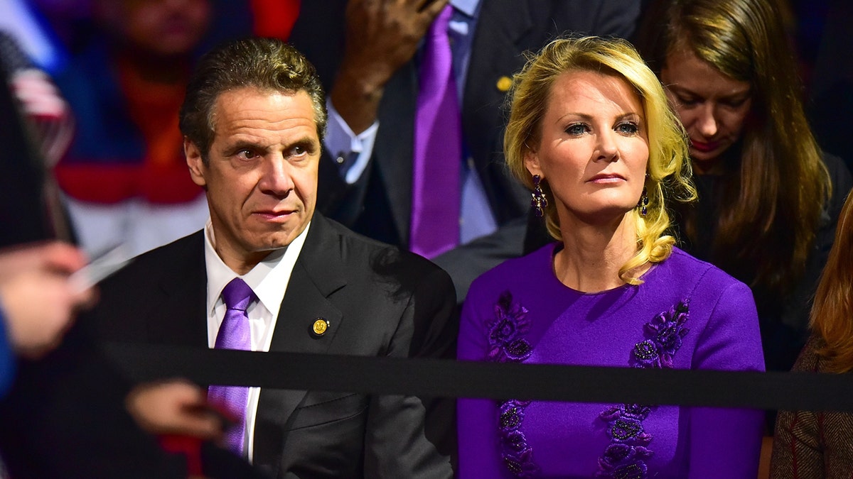 Andrew Cuomo and Sandra Lee sit side by side