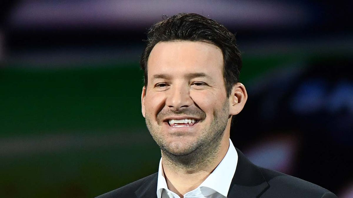 Tony Romo speaks at an event