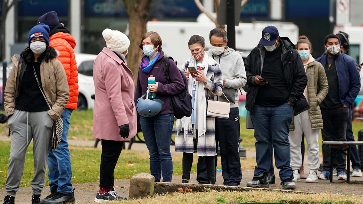 People stand in line in Washington, D.C. to receive a coronavirus test