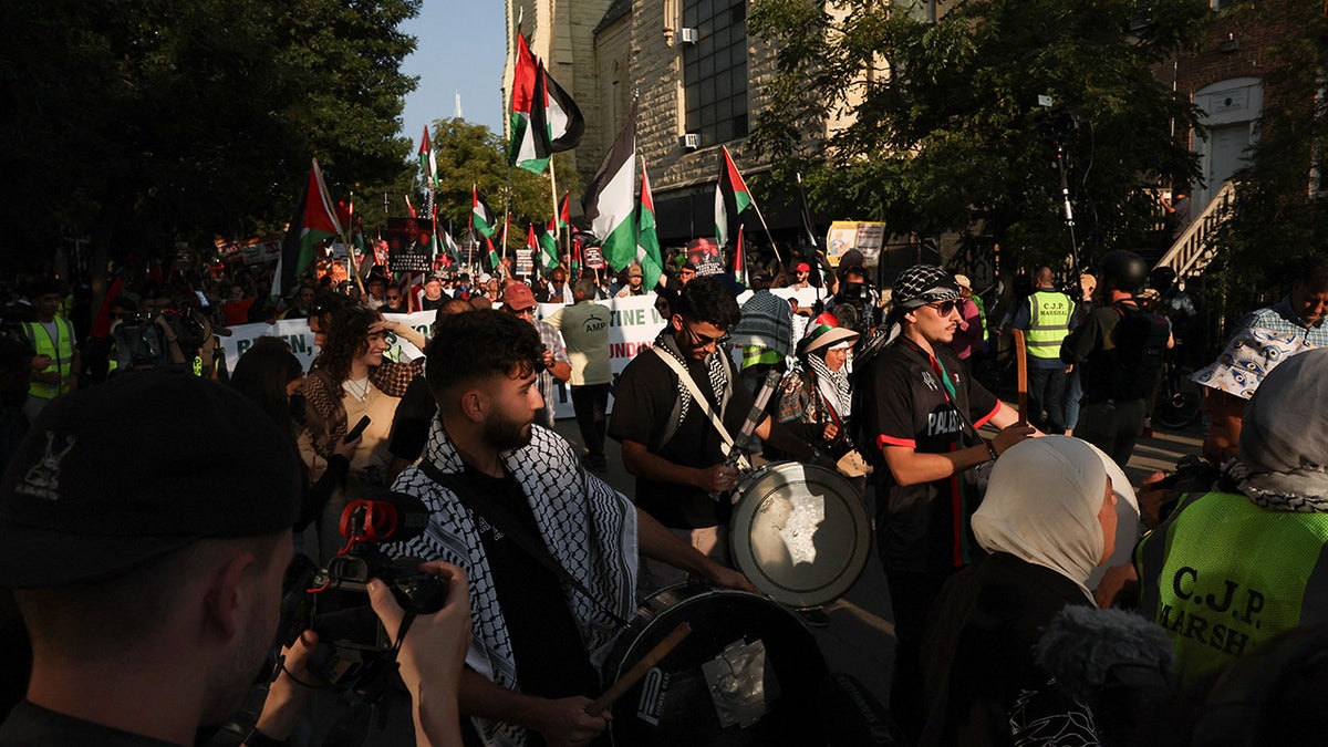 Demonstrators carry flags during a protest in support of Palestinians in Gaza