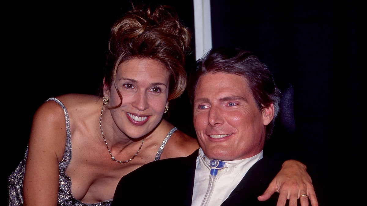 Dana Reeve poses with Christopher Reeve in his wheelchair