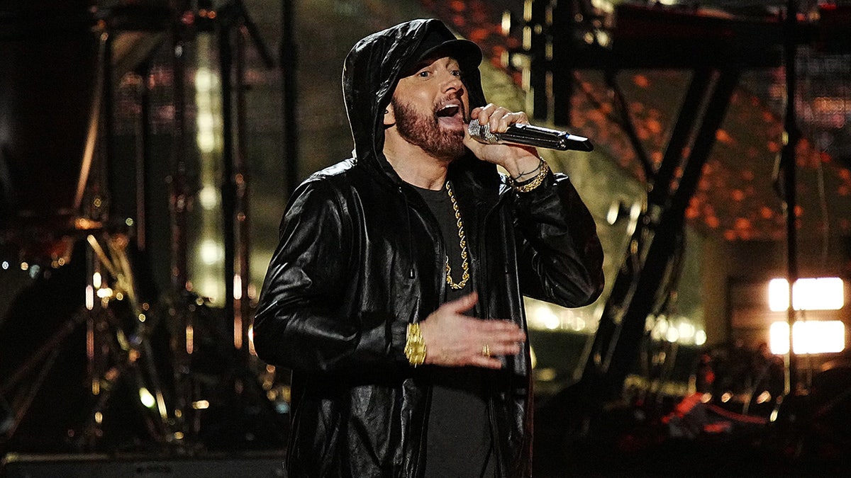 Eminem singing in front of the microphone