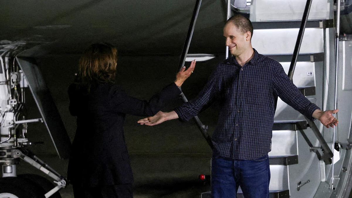 Evan Gershkovich, who was released from detention in Russia, is greeted by U.S. Vice President Kamala Harris as he disembarks from a plane at Joint Base Andrews in Maryland, U.S., August 1, 2024.