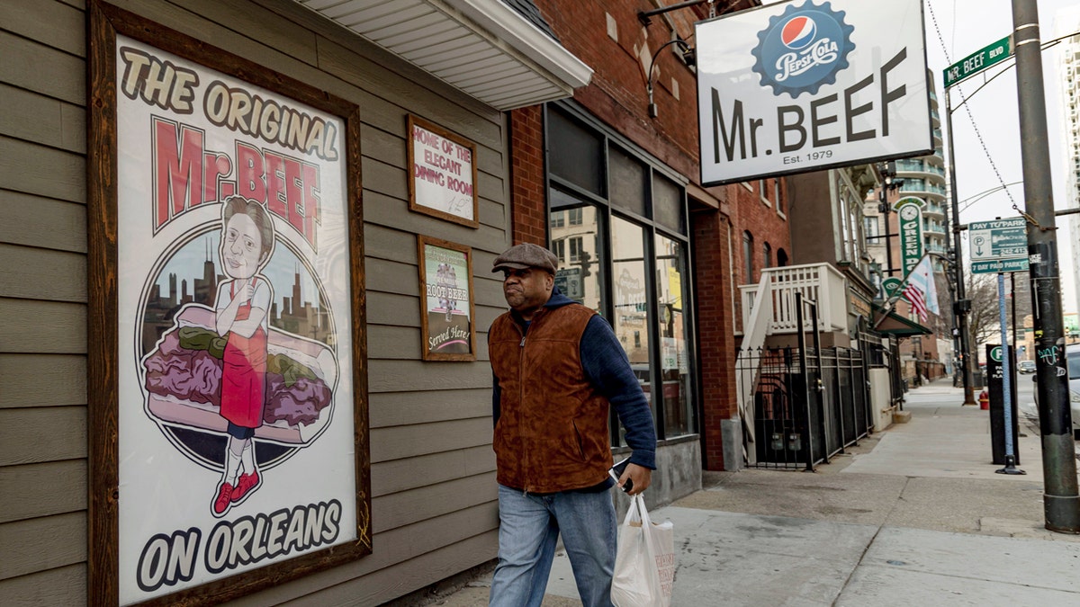 A man walks past Mr. Beef, where exteriors for the show "The Bear" were filmed, in Chicago's River North neighborhood on Dec. 19, 2022.