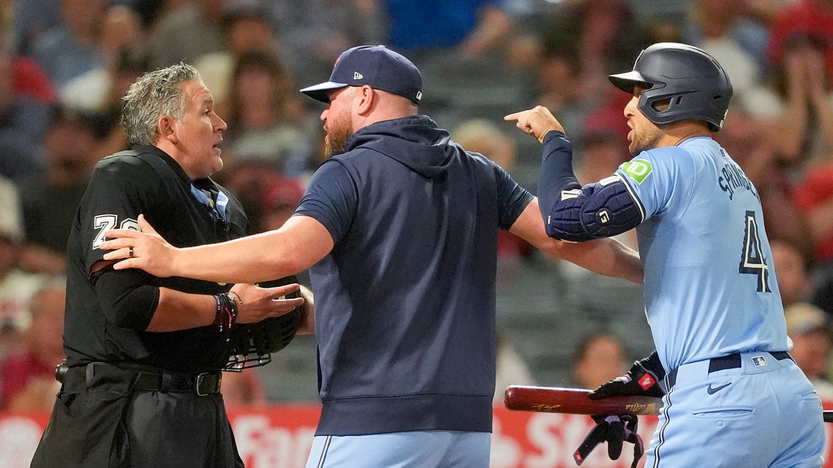 George Springer argues with umpire