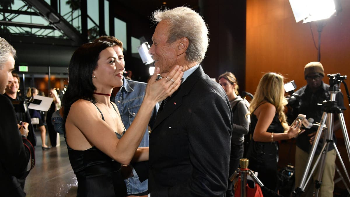 francesca eastwood embracing her father clint eastwood at the premiere of his movie "Sully"