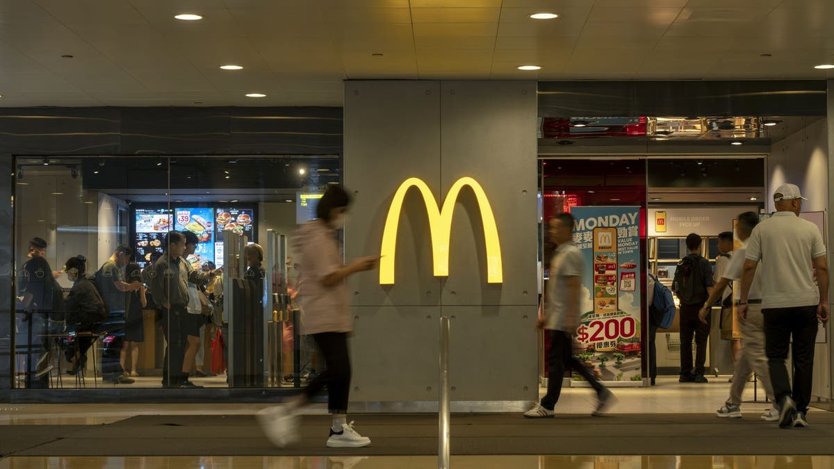 Customers are seen outside one of the country's largest fast food chains, McDonald's. (Getty Images)