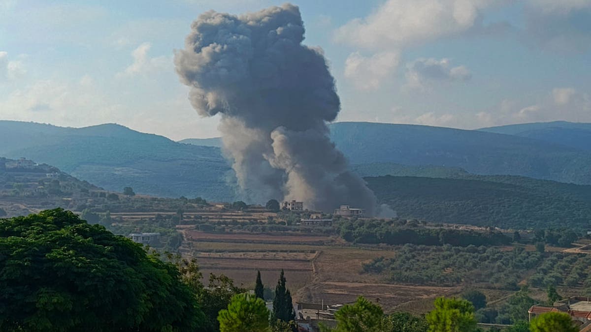 Smoke billows from the site of an Israeli airstrike on Zibqin in southern Lebanon on August 25, 2024, amid escalations in the ongoing cross-border tensions. Hezbollah terror group claimed early on August 25 it had launched more than 320 rockets at Israel overnight, targeting a string of military positions, even as Israel's military said it was carrying out pre-emptive strikes against the group. (Photo by KAWNAT HAJU/AFP via Getty Images)