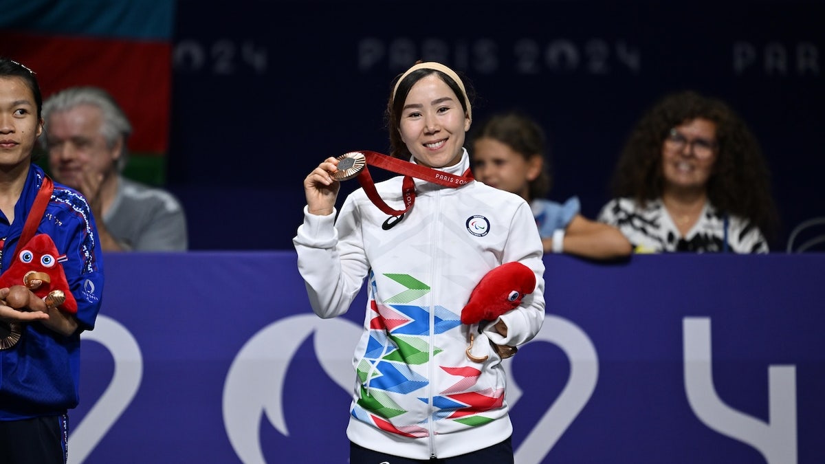 Bronze medallist Zakia Khudadadi of the Refugee Paralympic Team poses during the medal ceremony after the women's Para Taekwondo K44 -47kg final on day one of the Paris 2024 Summer Paralympic Games at Grand Palais on August 29, 2024 in Paris.