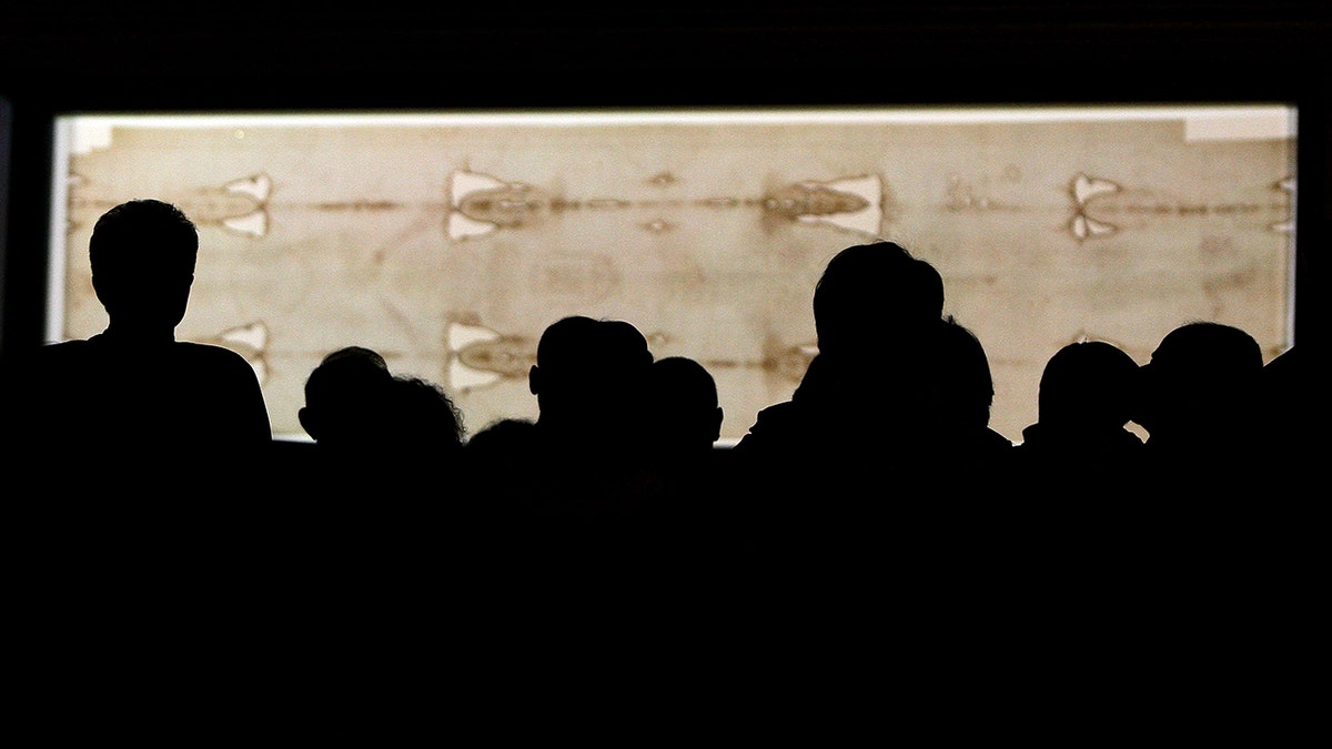 Spectators view the Shroud of Turin in Italy