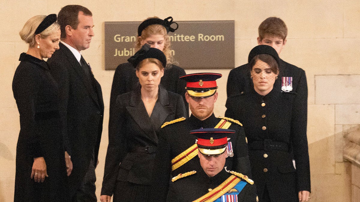 The royal cousins all wearing black and in a somber mood.