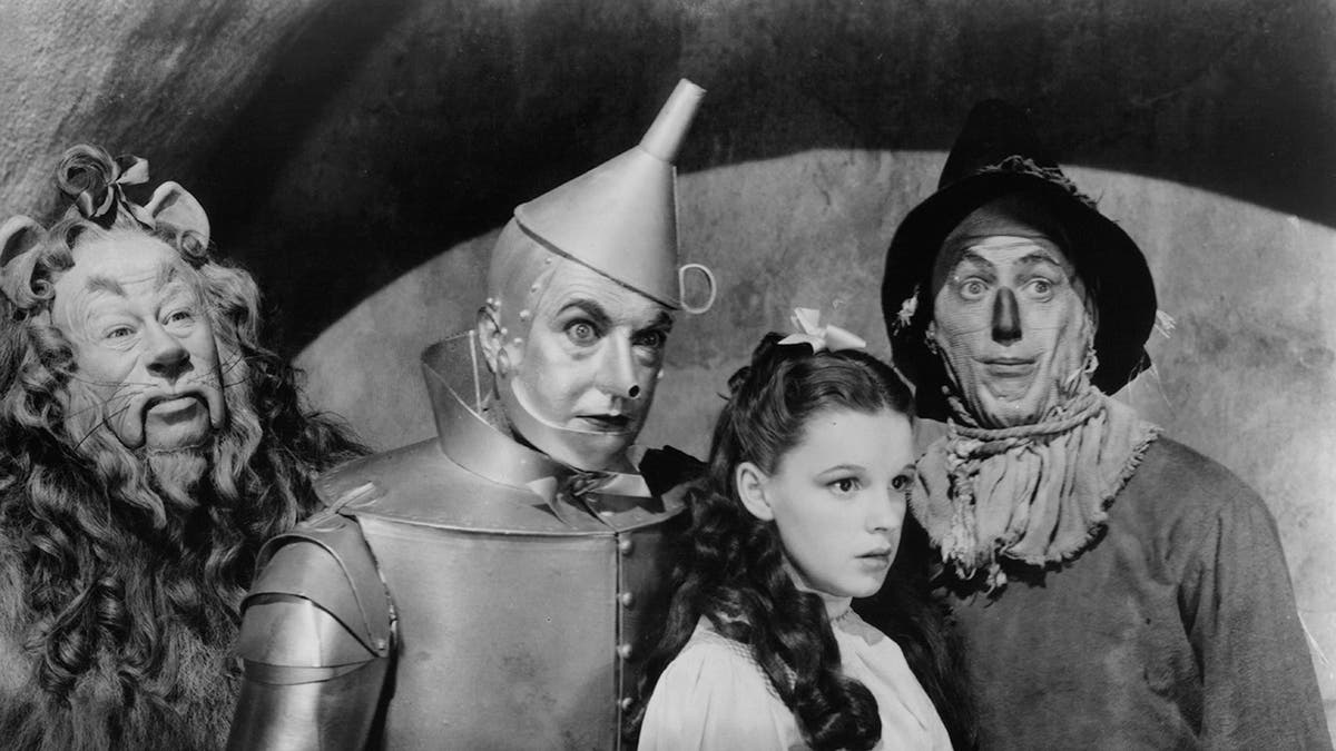 The cast of The Wizard of Oz looking serious.