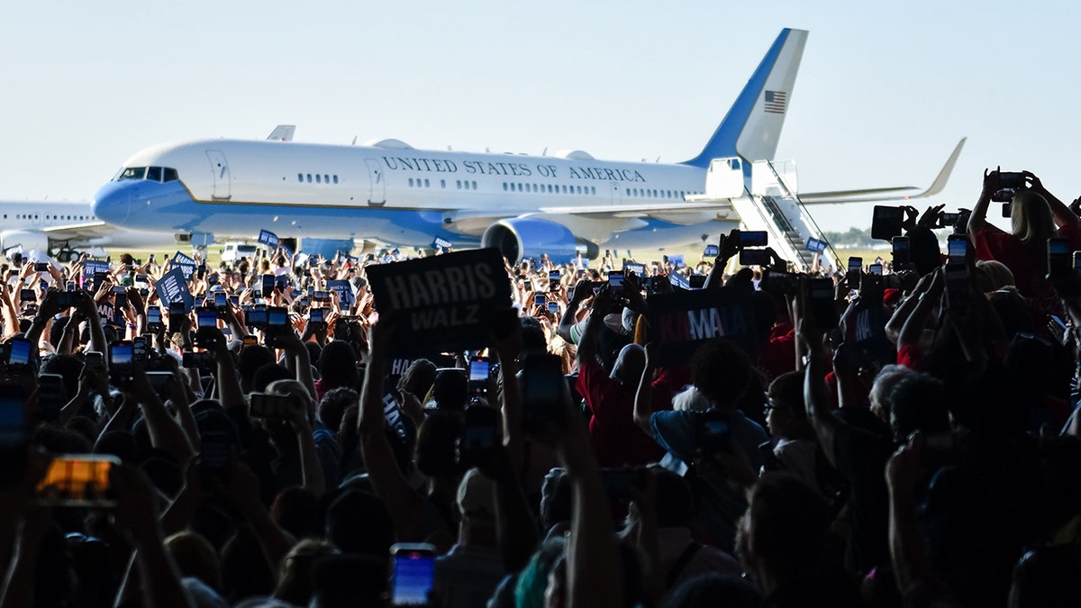 Harris supporters cheer upon arrival in Detroit