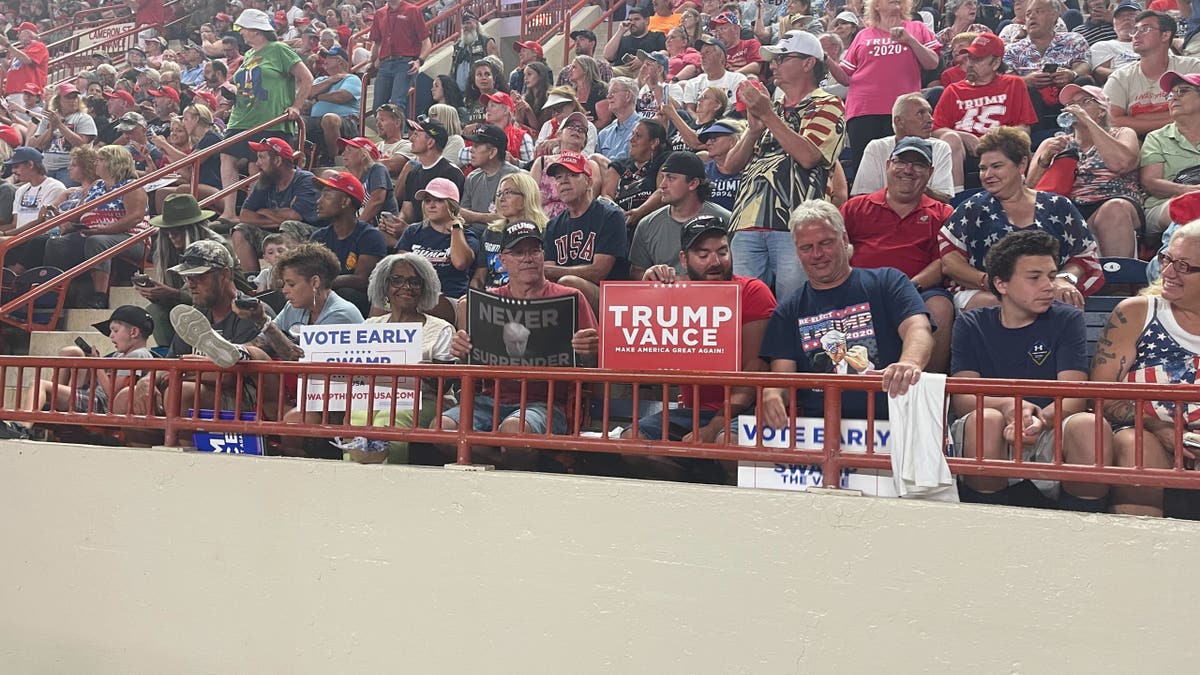 The air was electric inside the rally, but outside, people clashed over race, inflation and the nation's future.