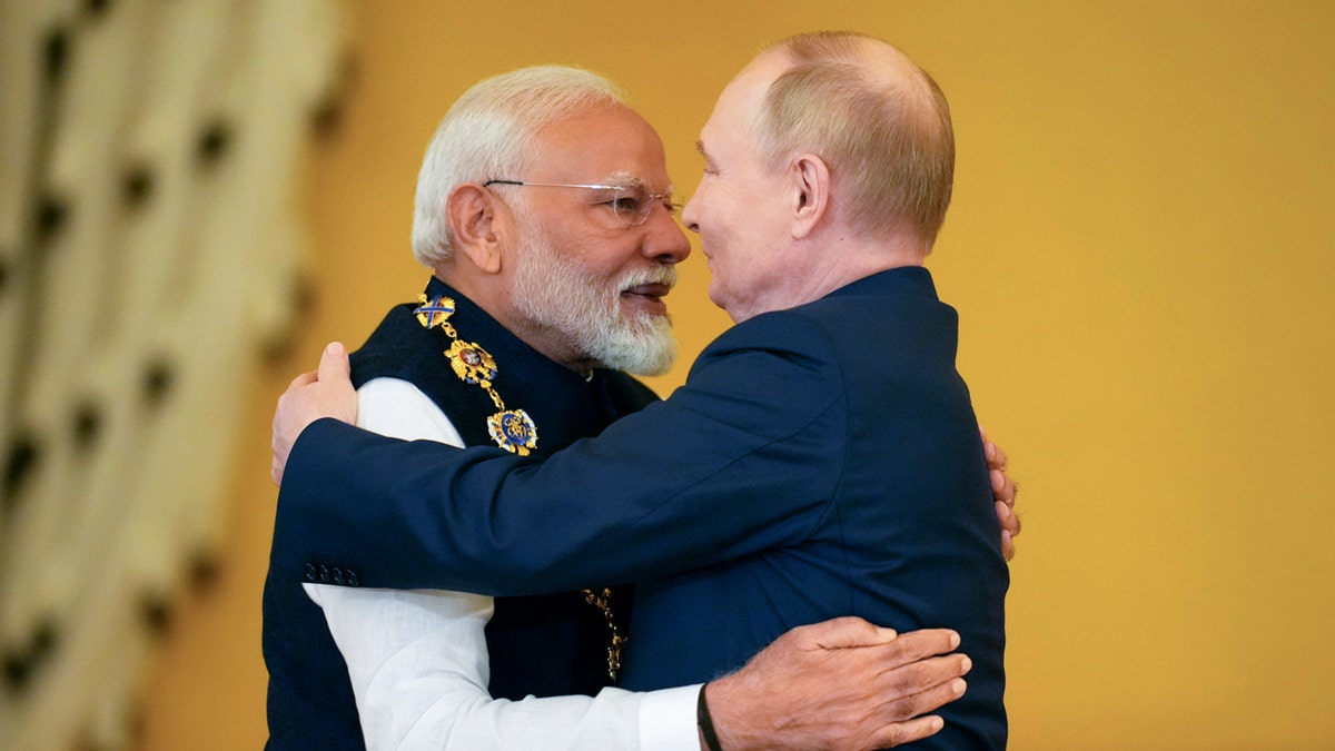 Indian Prime Minister Narendra Modi hugs Russian President Vladimir Putin.