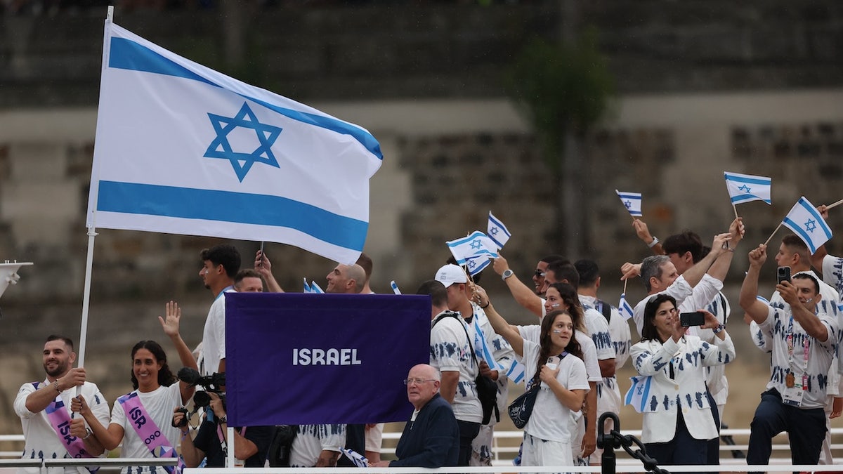 Team Israel flagbearers Andrea Murez and Peter Paltchik.