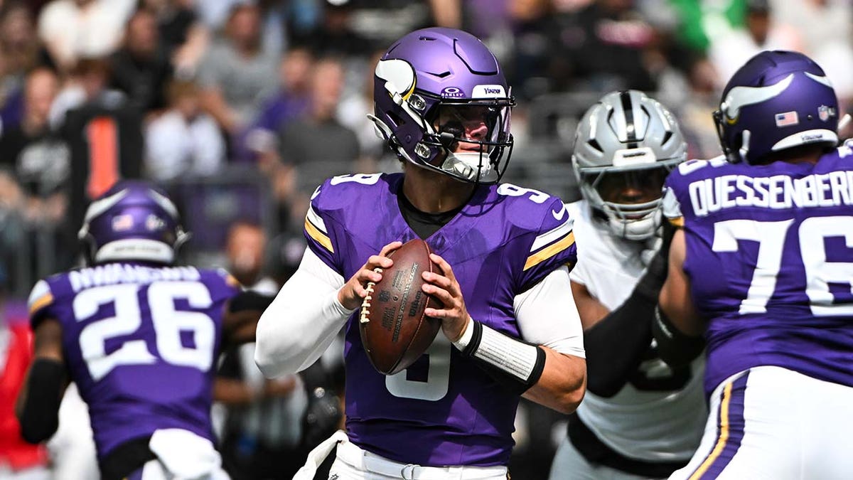 J.J. McCarthy looks to pass during a preseason game