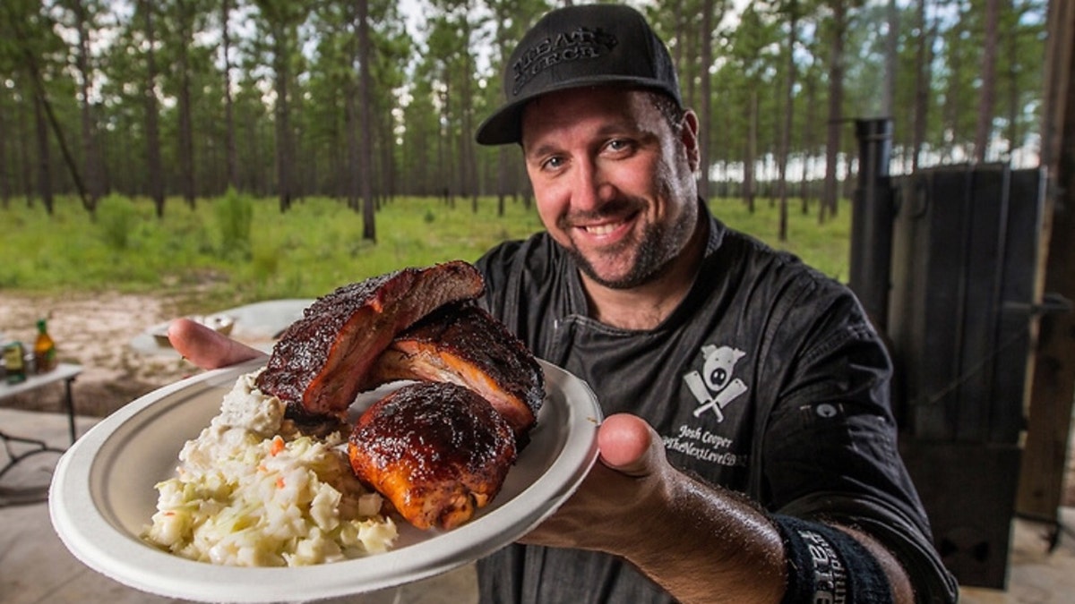 Josh Cooper of Cooper's Next Level BBQ shows off a plate of barbecue.