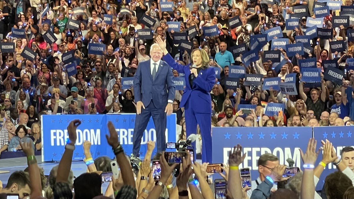 Harris and Walz on stage at a rally