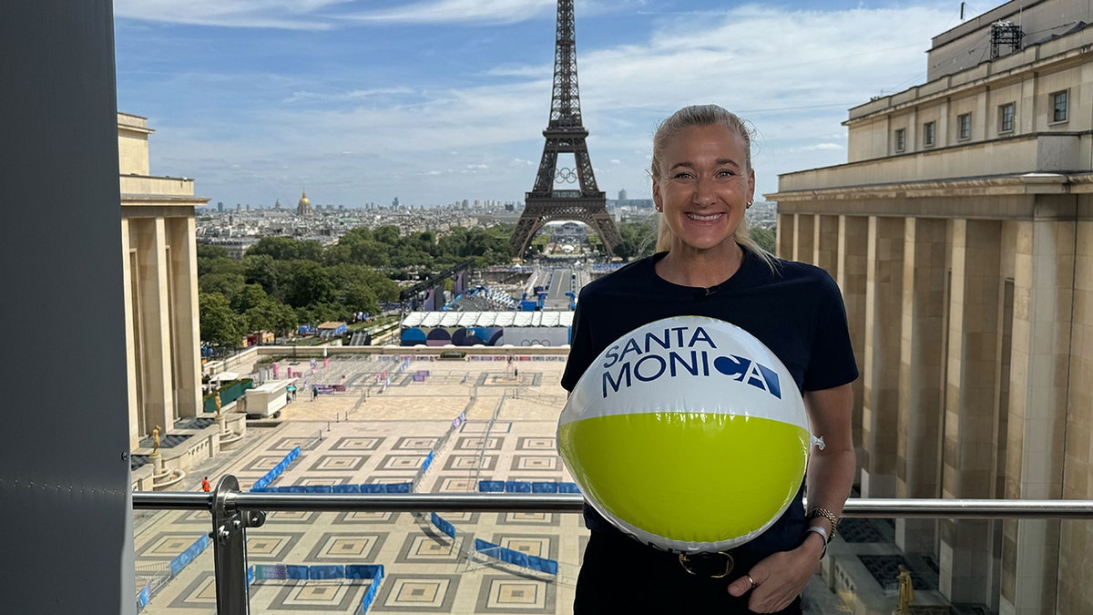 Kerri Walsh Jennings in front of Eiffel Tower