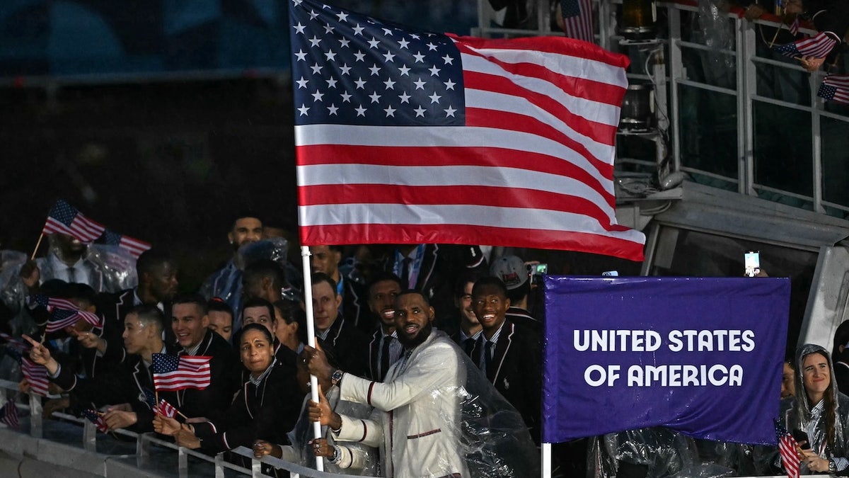 LeBron James stands with other members of his delegation.