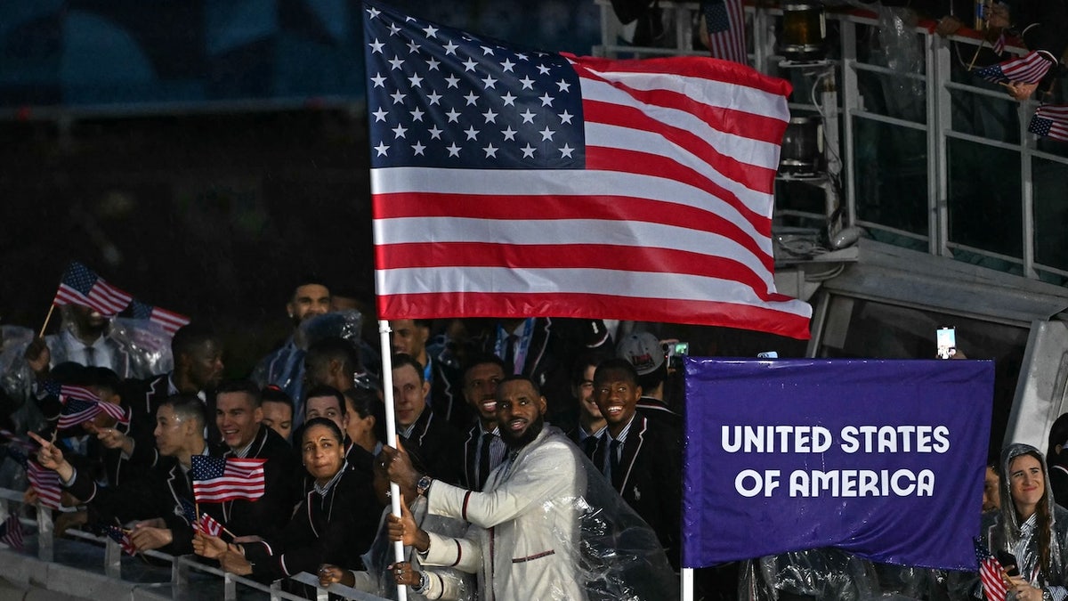 LeBron James stands with other members of his delegation.