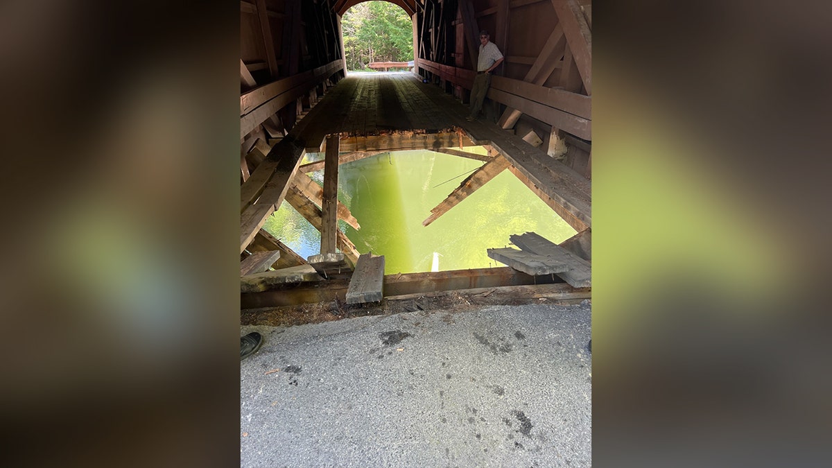 Gaping hole in covered bridge in Maine